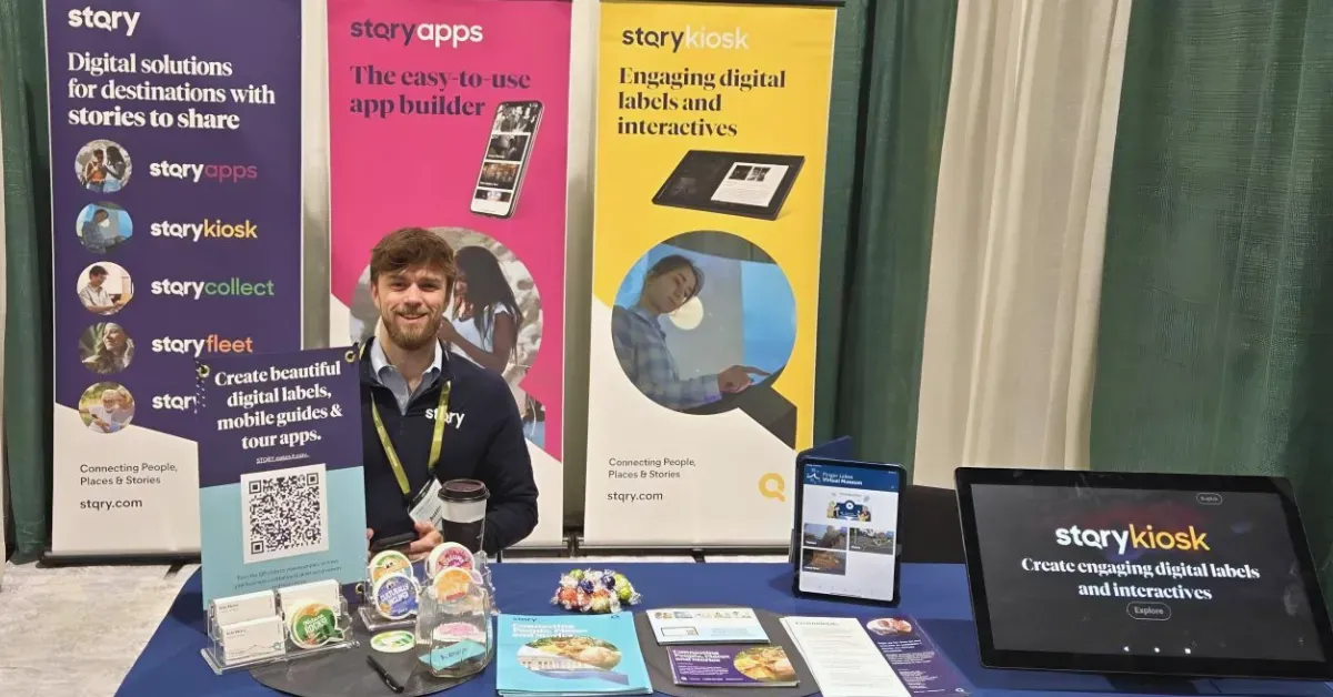 Austin Luff, STQRY Territory Manager, engaging visitors at the STQRY exhibit booth during a 2026 museum conference.