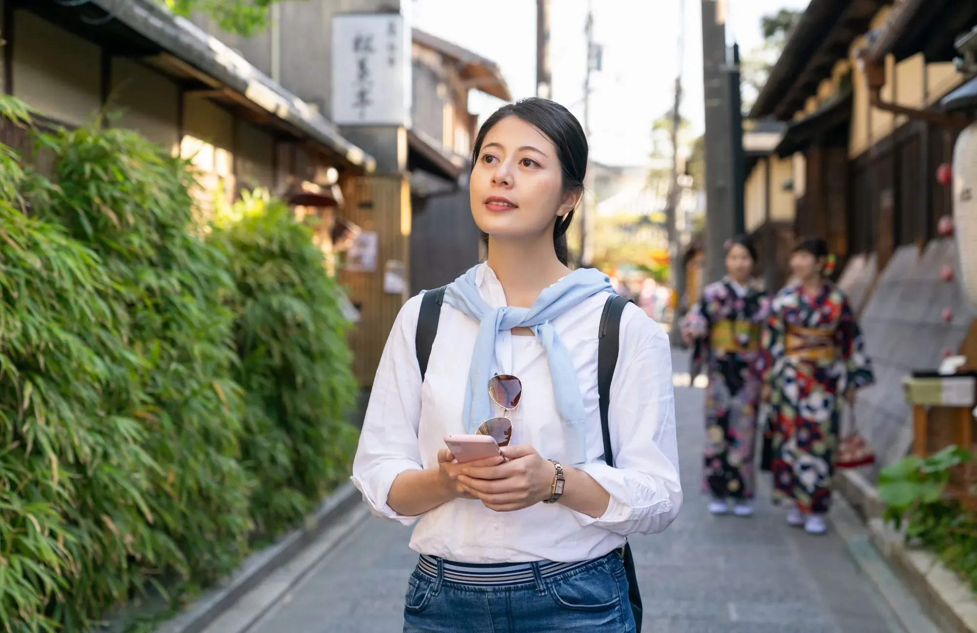 A woman exploring a city using a self-guided tour app.
