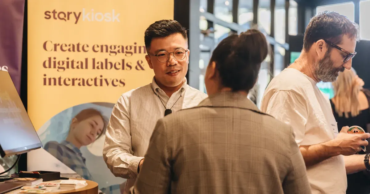STQRY Territory Manager Len Yu speaking with attendees at a museum conference.