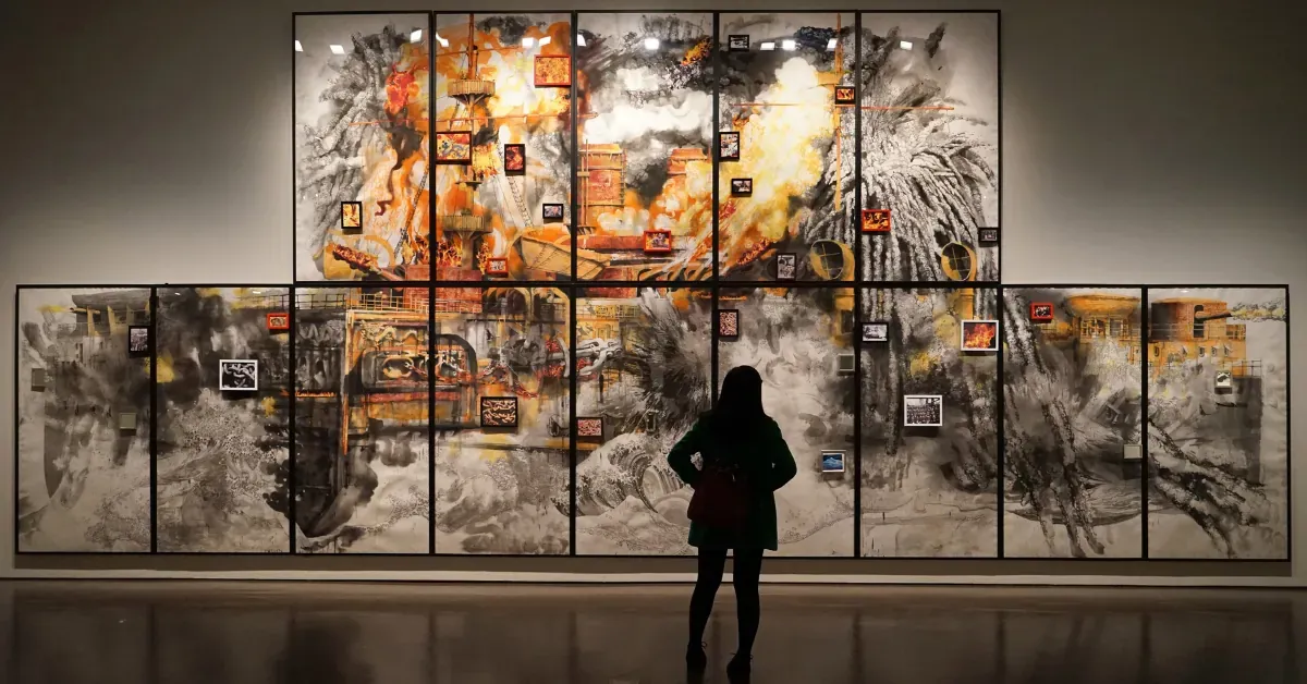 A woman looking at an artwork in a museum,